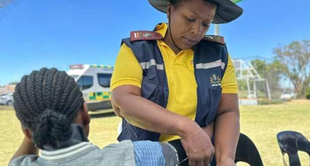 A learner from Lulama Higher Primary School in Soweto is screened by an Integrated School Health nurse.