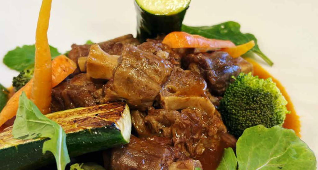 braised ostrich neck with steamed dumplings and pan-grilled vegetables