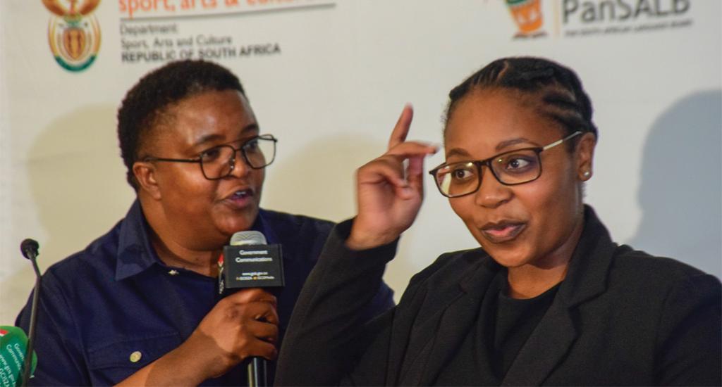 Deputy Minister for Women, Youth and People with Disabilities Mmapaseka Steve Letsike and SASL Interpreter, Ms Nomsa Mathebula.